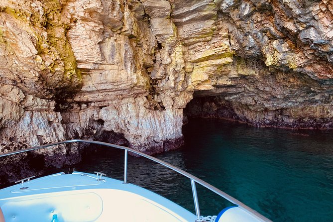 Boat tour of the Polignano a Mare caves with aperitif - Lama Monachile (the postcard beach) and the Domenico Modugno statue