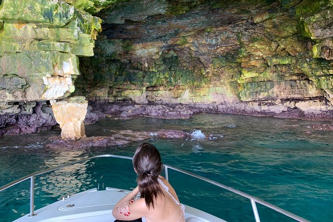 Boat tour of the Polignano a Mare caves with aperitif - Scoglio dell’Eremita: legends, a chapel, and an iron cross on the rock