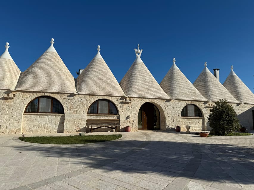 From Bari: Alberobello and Matera Day Trip - Rione Monti trulli walk: learning to read the stone roofs