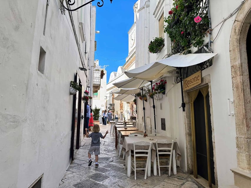 Itria Valley: Polignano, Ostuni, and Locorotondo, from Bari - Polignano a Mare cliffs: sea caves and a town named for Domenico Modugno
