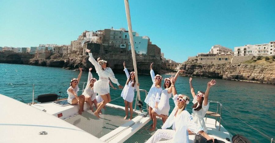 Polignano: Catamaran Cruise with Aperitif and Food - Grotta Palazzese, Lama Monachile, and the Red Bull cliff-diving site