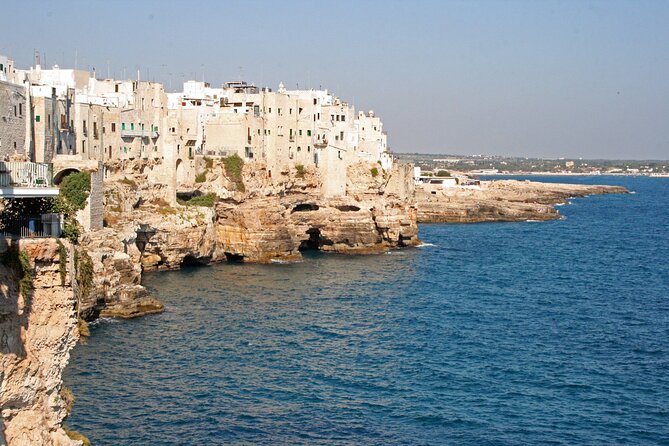 Street food tour of Polignano a Mare - Stop 2: Domenico Modugno statue and what it teaches you